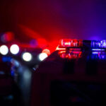 Police car lights shining in the dark
