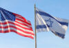 American and Israeli flags waving against a clear sky