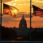 This Battle Could Steal Trump’s Legislative Power Silhouetted American flags in front of the Capitol building during sunset