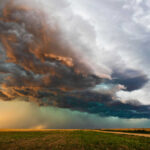 Catastrophic Storm Wipes Out American Villages Dramatic storm clouds over a flat landscape.