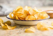 A bowl filled with golden, crispy potato chips