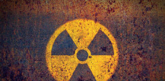 Faded radiation symbol on a rusty surface