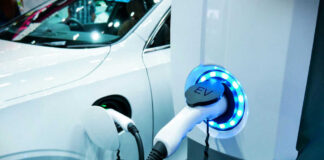 Electric vehicle charging at a station