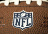Close-up of NFL logo on American football.