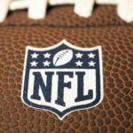 NFL Player Gunned Down in Manhattan Close-up of NFL logo on American football.