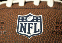 Close-up of NFL logo on American football.