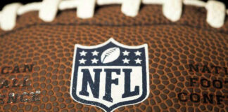 Close-up of NFL logo on American football.
