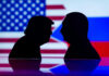 Silhouettes of Donald Trump and Vladimir Putin with USA and Russia flags