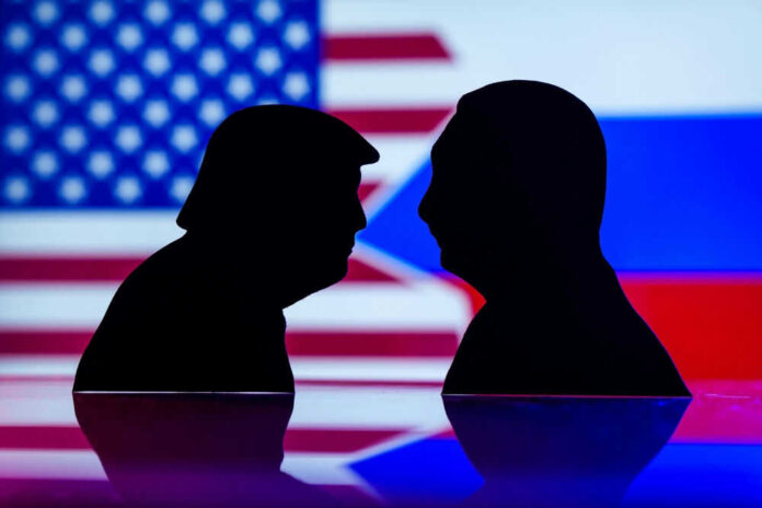 Silhouettes of Donald Trump and Vladimir Putin with USA and Russia flags