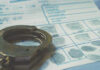 Handcuffs on a fingerprint document.