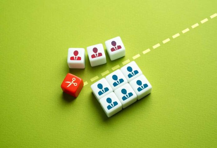 Colorful dice representing business roles and a scissors icon on a green background