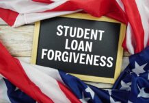 Chalkboard with the text 'STUDENT LOAN FORGIVENESS' surrounded by American flags