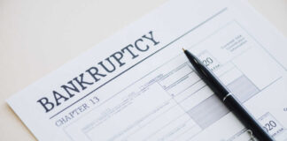 Bankruptcy Chapter 13 form with a pen resting on it
