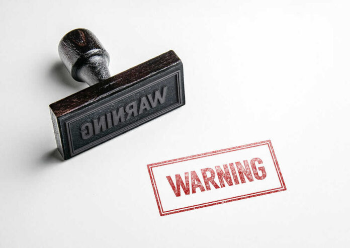 Rubber stamp with warning text imprint