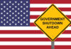 American flag government shutdown warning sign