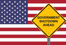 American flag government shutdown warning sign