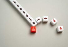 A red warning block surrounded by white blocks with directional arrows