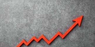 Red arrow graph indicating upward trend on a textured background