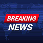 Breaking News text on world map background.