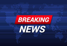 Breaking News text on world map background.