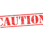 Red caution sign with grunge texture diagonal