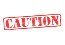 Red caution sign with grunge texture diagonal