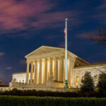 The United States Supreme Court building at dusk.