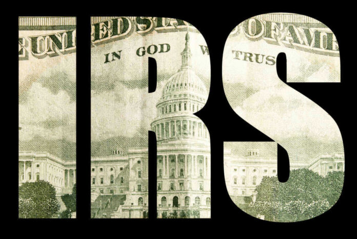 shutterstock_175801328.jpg IRS letters with US Capitol building inside.