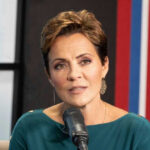 Kari Lake speaking into a microphone.