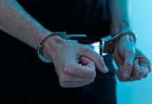 Close-up of hands in handcuffs