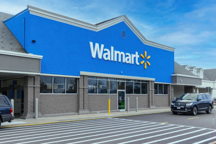 shutterstock_2415634825.jpg Walmart store exterior with parked cars