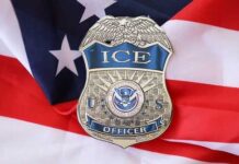 ICE officer badge placed on an American flag