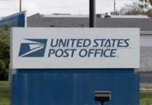 NOW: First-Ever USPS Fuel Fee Hits Sign for the United States Post Office