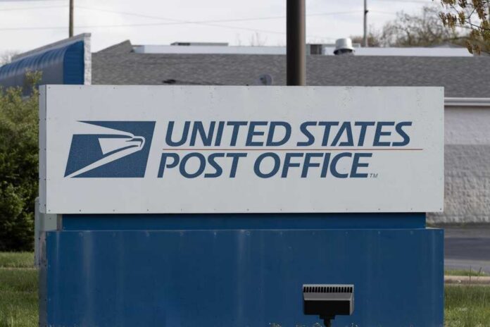 shutterstock_2452735877.jpg Sign for the United States Post Office