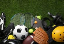 American Athlete Defies PTSD Crash Nightmare Variety of sports equipment arranged on green grass