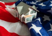A model house placed on an American flag