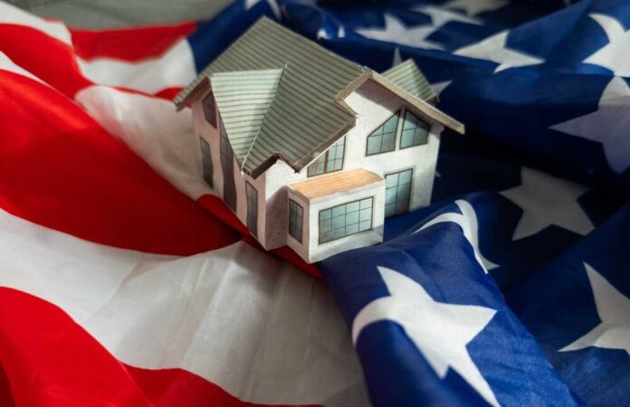 A model house placed on an American flag