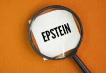 Magnifying glass over a piece of paper with the word 'EPSTEIN'