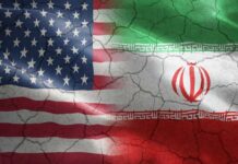 Flags of the United States and Iran blended together with a cracked texture