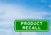 UNSEEN Ingredient Triggers Drink Recall Green sign with product recall text and sky background