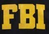 FBI logo displayed in large yellow letters on a black background