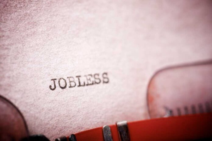 shutterstock_2278998513.jpg Close-up of a typewriter with the word 'JOBLESS' typed on paper
