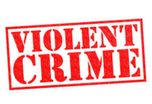 Red stamp with the words VIOLENT CRIME
