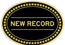 A badge displaying the text 'NEW RECORD' surrounded by gold stars