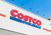 Costco Wholesale store sign against a blue sky
