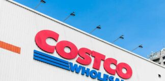 Costco Wholesale store sign against a blue sky