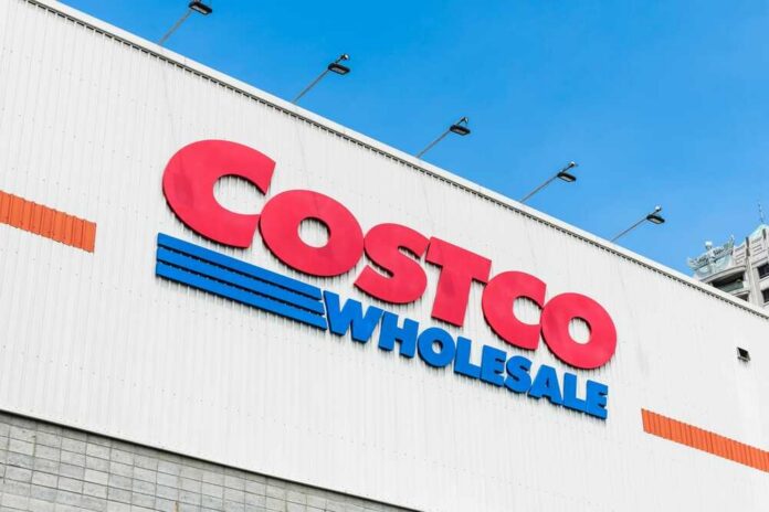 Costco Wholesale store sign against a blue sky