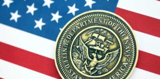 Navy medal placed on an American flag background