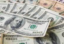 Trump’s Bombshell: $35 Billion Nobody Expected Stacks of various U.S. dollar bills.