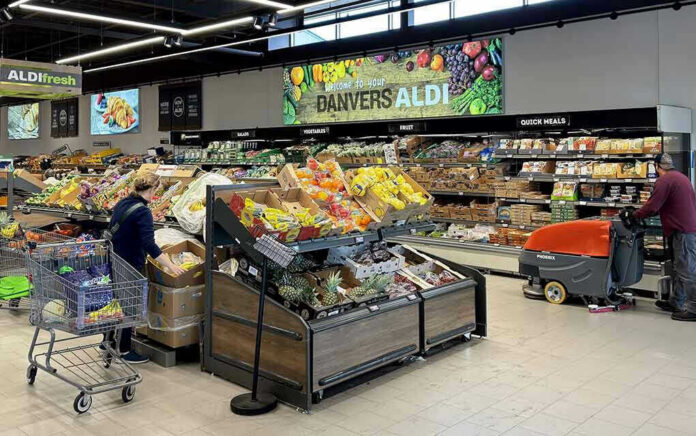2476207967 People shopping and cleaning inside an Aldi supermarket.